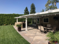 Existing low lying patio cover before replacement